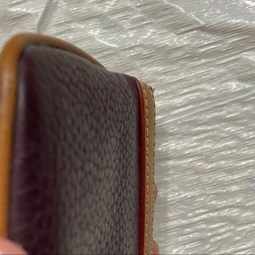 Dooney & Bourke purple and brown leather cosmetic bag